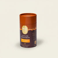 Ceylon cinnamon packaging with a brown lid on a beige background